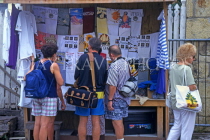 ANTIGUA, St John's, tourists shopping at souvenir clothing stall, ANT844JPL
