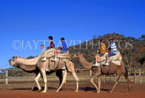 AUSTRALIA, Northern Territory, Alice Springs, visitors on camel ride, AUS423JPL
