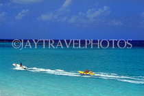 BAHAMAS, New Providence Island, seascape with tourists on banana boat ride, BAH267JPL