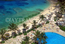 BAHAMAS, Paradise Island, beach and sunbathers by pool, BAH257JPL