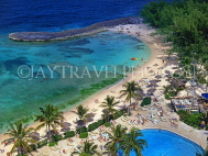 BAHAMAS, Paradise Island, beach and sunbathers by pool, BAH350JPL