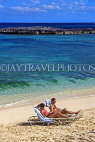 BAHAMAS, Paradise Island, beach and sunbathing couple, BAH246JPL
