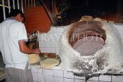 BAHRAIN, Khaboos (Kuboos) flat bread making, and clay oven, BHR1509JPL