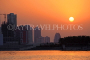 BAHRAIN, Manama, King Faisala Corniche, Sunset over Reef Island, BHR722JPL