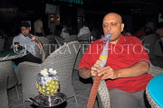 BAHRAIN, Muharraq, Amwaj Islands, cafe scene, man smoking Shisha Pipe, BHR1562JPL