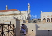 BAHRAIN, Muharraq, Shaikh Isa Bin Ali House, mosque minaret, and visitor, BHR818JPL