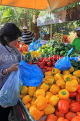 BAHRAIN, Noor El Ain, Garden Bazaar, Farmers Market, shopper at vegetable stall, BHR1158JPL
