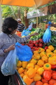 BAHRAIN, Noor El Ain, Garden Bazaar, Farmers Market, shopper at vegetable stall, BHR1159JPL