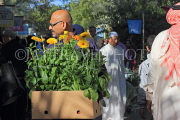BAHRAIN, Noor El Ain, Garden Bazaar, Farmers Market, shopper with flowers, BHR1164JPL
