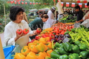 BAHRAIN, Noor El Ain, Garden Bazaar, Farmers Market, stalls, peppers, and shopper, BHR2024JPL