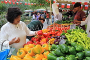 BAHRAIN, Noor El Ain, Garden Bazaar, Farmers Market, stalls, peppers, and shopper, BHR2026JPL