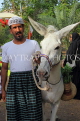 BAHRAIN, Noor El Ain, Grand Bazaar, Farmers Market, man with donkey, BHR2092JPL