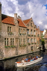 Belgium, BRUGES, 17th century buildings along Dyver Canal and sightseeing boat, BEL297JPL