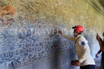 CAMBODIA, Siem Reap, Angkor Wat, Bas Relief Galleries (western section), tour guide, CAM419JPL