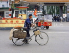 CHINA, Hebei Province, CHENGDE, street scene, cyclist with basket attached, CH1411JPL