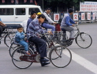 CHINA, Hebei Province, Chengde, bicycle traffic, child on back satof bike, CH1376JPL