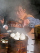 CHINA, Sichuan Province, Daocheng, fresh dumplings being cooked, CH1571JPL