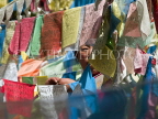 CHINA, Yunnan Prov, Shangri La, Meili Snow Mountains Nat Park, pilgrim hanging prayer flags, CH1590JPL