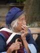 CHINA, Yunnan Province, Lijiang, Naxi women in traditionalan smoking, CH1569JPL