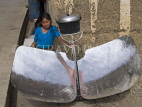CHINA, Yunnan Province, Shangri La, girl with a solar cooker, CH1650JPL