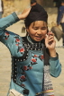 CHINA, Yunnan Province, Yuanyang, Hani (Akha) hill tribe girl with mobile phone, CH1633JPL