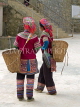 CHINA, Yunnan Province, Yuanyang, Hani tribe women with baskets, Shalatou market, CH1544JPL