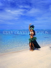 COOK ISLANDS, Rarotonga, beach, Maori dancer in traditional island dress, CI763JPL
