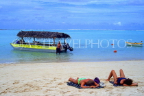 COOK ISLANDS, Rarotonga, beach and tourist couple sunbathing, CI144JPL