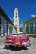 CUBA, Trinidad, old Chevy Convertible and Belltower of Luncha Contra Bandidos Museum, CUB368JPL
