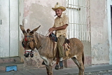 CUBA, Trinidad, old town street, elderly man on donkey, CUB363JPL