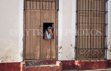 CUBA, Trinidad, old town street, elderly woman at window, CUB365JPL