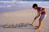 CUBA, Varadero, beach, boy writing Cuba on sand, CUB228JPL