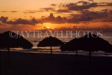 CUBA, Varadero, beach, sunset and thatched sunshades, CUB252JPL