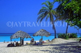 CUBA, Varadero, beach, thatched sunshades and coconut trees, CUB114JPL