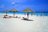 CUBA, Varadero, beach, thatched sunshades and sunbathers, CUB108JPL