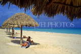 CUBA, Varadero, beach, thatched sunshades and sunbathers, CUB243JPL