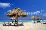 CUBA, Varadero, beach, thatched sunshades and sunbathers, CUB244JPL