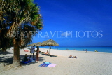 CUBA, Varadero, beach, thatched sunshades and sunbathers, CUB250JPL