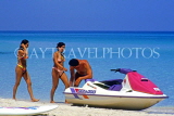 CUBA, Varadero, beach, two women walking along, and waterscooter, CUB317JPL