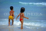 CUBA, Varadero, beach and Cuban children paddling, CUB325JPL