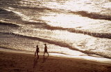 CUBA, Varadero, couple along beach, dusk view, CUB783JPL