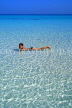 CUBA, Varadero, seascape, boy (tourist) swimming in shallow sea, CUB320JPL