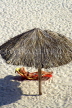 CUBA, Varadero, sunbather under thatched sunshade, CUB190JPL