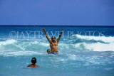 CUBA, Varadero, tourist (man) enjoying playing in the sea, CUB316JPL