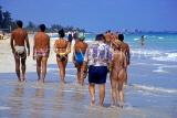 CUBA, Varadero, tourists walking along beach, CUB327JPL