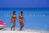 CUBA, Varadero, two women walking along beach, CUB122JPL