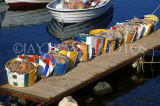 CYPRUS, Akamas area, Latchi, fishing harbour, nets in bags, lined up on pier, CYP449JPL