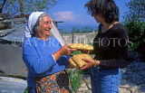 CYPRUS, Kritou, Tera, woman giving traditional Easter Sesame Bread, CYP111JPL