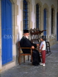 CYPRUS, Larnaca, Ayios Lazarus Church, priest talking to child, CYP127JPL