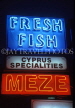CYPRUS, Limassol, neon lit (fish, meze) sign, CYP334JPL